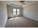 Sun-filled bedroom with neutral decor, plush carpeting, and ample natural light, creating a cozy and inviting atmosphere at 141 Trescott St, Smithfield, NC 27577