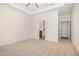 Spacious bedroom showcasing neutral walls and carpet along with doorways at 141 Trescott St, Smithfield, NC 27577