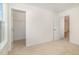 Spare bedroom with a closet, neutral walls, carpet, and doorway at 141 Trescott St, Smithfield, NC 27577
