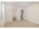 Cozy bedroom with carpet, featuring a closet and white door leading to additional space at 141 Trescott St, Smithfield, NC 27577