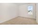 Standard bedroom with neutral walls and carpet and a window to let in natural light at 141 Trescott St, Smithfield, NC 27577