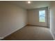 Simple bedroom with carpet floors and natural light at 141 Trescott St, Smithfield, NC 27577