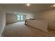 Open bonus room featuring carpet floors and natural light at 141 Trescott St, Smithfield, NC 27577