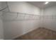 Spacious walk-in closet featuring ample shelving, offering an abundance of storage space for clothing and accessories at 141 Trescott St, Smithfield, NC 27577