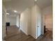 Bright hallway leads to the living area with fireplace and bathroom featuring modern fixtures at 141 Trescott St, Smithfield, NC 27577