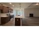 Modern kitchen featuring a large island, stainless steel appliances, and stylish pendant lighting at 141 Trescott St, Smithfield, NC 27577