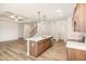 Contemporary kitchen with center island, stainless steel appliances, and open layout at 141 Trescott St, Smithfield, NC 27577