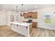 Modern kitchen featuring a center island, stainless steel appliances, and wood cabinets at 141 Trescott St, Smithfield, NC 27577