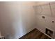Laundry room with vinyl flooring and a wire rack at 141 Trescott St, Smithfield, NC 27577