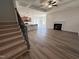 Open-concept living area featuring hardwood floors, a fireplace, and seamless flow to the kitchen, creating a bright and airy space at 141 Trescott St, Smithfield, NC 27577