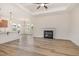 Bright living room with a fireplace and open floor plan, featuring hardwood flooring at 141 Trescott St, Smithfield, NC 27577