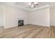 Spacious living room with hardwood flooring, a fireplace, and coffered ceilings at 141 Trescott St, Smithfield, NC 27577