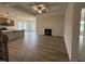 Open-concept living area with a fireplace, coffered ceilings, and seamless transition to the modern kitchen at 141 Trescott St, Smithfield, NC 27577