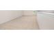 Spacious loft with neutral walls and carpet and a window to let in natural light at 141 Trescott St, Smithfield, NC 27577
