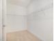 Walk-in closet with carpet and wire shelving for clothing and storage at 141 Trescott St, Smithfield, NC 27577