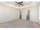 Large bedroom with carpet flooring and views to ensuite bathroom at 143 Royal Ave, Selma, NC 27576