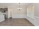 Bright dining area with elegant lighting fixtures and classic wainscoting at 143 Royal Ave, Selma, NC 27576