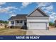 Charming one-story home featuring a two-car garage, covered porch and manicured front lawn at 143 Royal Ave, Selma, NC 27576