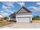 Charming single-Gathering home with a two-car garage and covered front porch at 143 Royal Ave, Selma, NC 27576