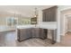 Open concept kitchen with granite countertops, gray cabinets, and view to living area at 143 Royal Ave, Selma, NC 27576