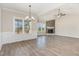 Well-lit open-concept living space with a fireplace and hardwood floors at 143 Royal Ave, Selma, NC 27576