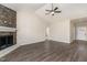 Spacious living room showcases a cozy fireplace and hardwood flooring at 143 Royal Ave, Selma, NC 27576