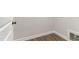 Unfurnished room features wood-look flooring and white trim at 143 Royal Ave, Selma, NC 27576