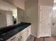 Bathroom featuring modern countertops, double sinks, and a large mirror at 147 Tuskeegee Dr, Smithfield, NC 27577