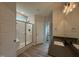 Bright bathroom with a glass-enclosed shower and stylish fixtures at 147 Tuskeegee Dr, Smithfield, NC 27577
