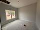 Bedroom featuring light-colored walls, and a large window at 147 Tuskeegee Dr, Smithfield, NC 27577