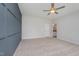 Spacious bedroom includes neutral carpet, a modern ceiling fan, and an ensuite bathroom at 147 Tuskeegee Dr, Smithfield, NC 27577