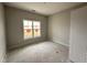 Bedroom featuring light-colored walls, and a large window at 147 Tuskeegee Dr, Smithfield, NC 27577