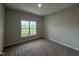 Bedroom showcasing neutral walls, plush carpeting, and natural light at 147 Tuskeegee Dr, Smithfield, NC 27577