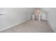 A spacious upper room featuring neutral walls and plush carpeting at 147 Tuskeegee Dr, Smithfield, NC 27577