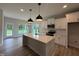 Modern kitchen featuring an island, stainless appliances, and beautiful countertops at 147 Tuskeegee Dr, Smithfield, NC 27577