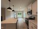 Eat-in kitchen with stainless appliances and a large island with pendant lighting at 147 Tuskeegee Dr, Smithfield, NC 27577