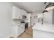 Well-lit kitchen features quartz countertops, stainless steel appliances, and ample cabinet space at 147 Tuskeegee Dr, Smithfield, NC 27577