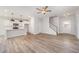 Spacious living room featuring a modern kitchen, staircase, and bright natural light at 147 Tuskeegee Dr, Smithfield, NC 27577
