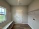 Inviting mud room with bench seating and storage, perfect for organization at 147 Tuskeegee Dr, Smithfield, NC 27577