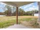 View of the spacious backyard with a covered patio, perfect for outdoor enjoyment at 15 Lupin Dr, Smithfield, NC 27577