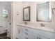 Bathroom features double sinks, large mirrors, and white cabinetry at 15 Lupin Dr, Smithfield, NC 27577