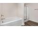 Clean, modern bathroom features a shower and a separate soaking tub at 15 Lupin Dr, Smithfield, NC 27577