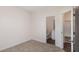 Bedroom with carpeted floors and access to an adjacent bathroom at 15 Lupin Dr, Smithfield, NC 27577