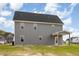 Rear exterior showcasing the home's siding and a covered back porch at 15 Lupin Dr, Smithfield, NC 27577