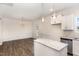 Well-lit kitchen area featuring a dining area and a kitchen island, perfect for cooking and enjoying meals at 15 Lupin Dr, Smithfield, NC 27577