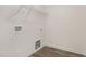 Practical laundry room with wood-look flooring and utility hookups at 15 Lupin Dr, Smithfield, NC 27577