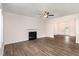 Spacious living room showcasing modern fireplace, neutral walls, and contemporary ceiling fan providing a welcoming atmosphere at 15 Lupin Dr, Smithfield, NC 27577