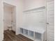 Functional mudroom with built-in bench and access to a full bathroom at 15 Lupin Dr, Smithfield, NC 27577