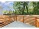 Relax on this property's wood back deck overlooking a grassy yard with mature trees at 15 St Augustine, Raleigh, NC 27610
