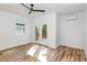 Bright bedroom with double doors leading to a private deck and wood-look flooring at 15 St Augustine, Raleigh, NC 27610